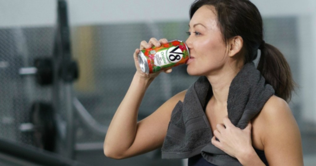 Woman drinking can of V8 Original 100% Vegetable Juice