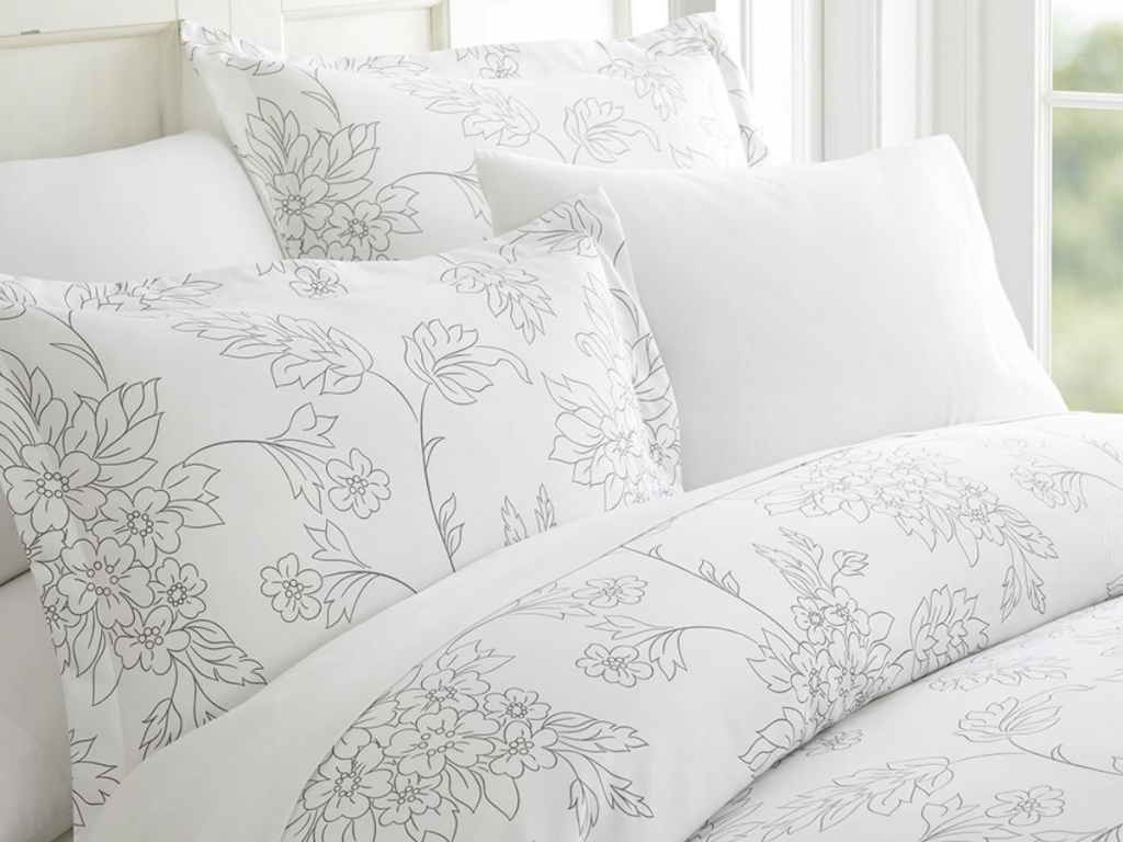 Vines Patterned 3-Piece Duvet Cover Set Grey with pillows on bed
