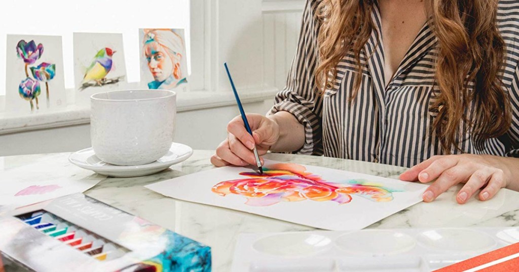artist painting with watercolor