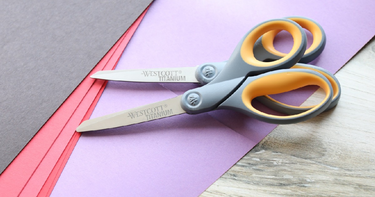 Two pairs of Westcott brand scissors in gray and yellow