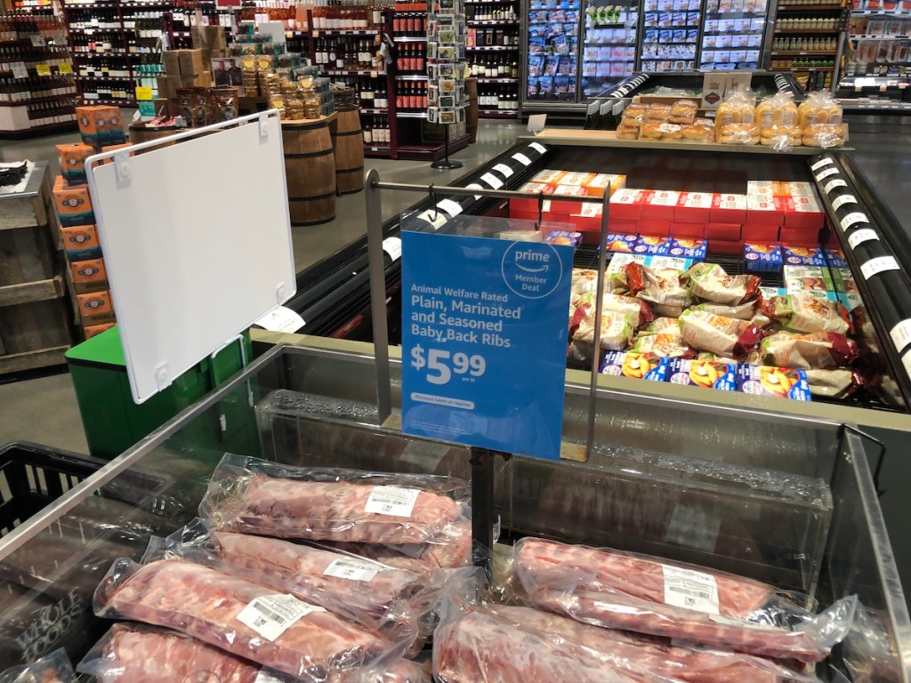 Whole foods cooler with baby back ribs and sale sign