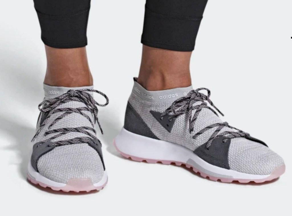 Woman wearing grey running shoes