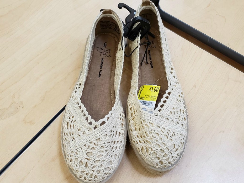 crochet beige shoes on table