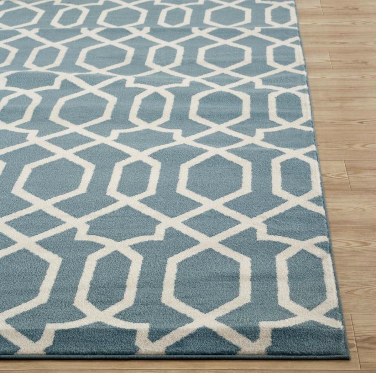 blue rug with white trellis design