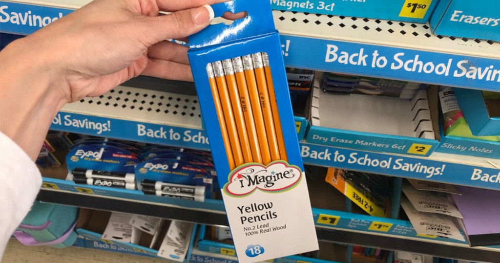 woman holding box of #2 pencils at store