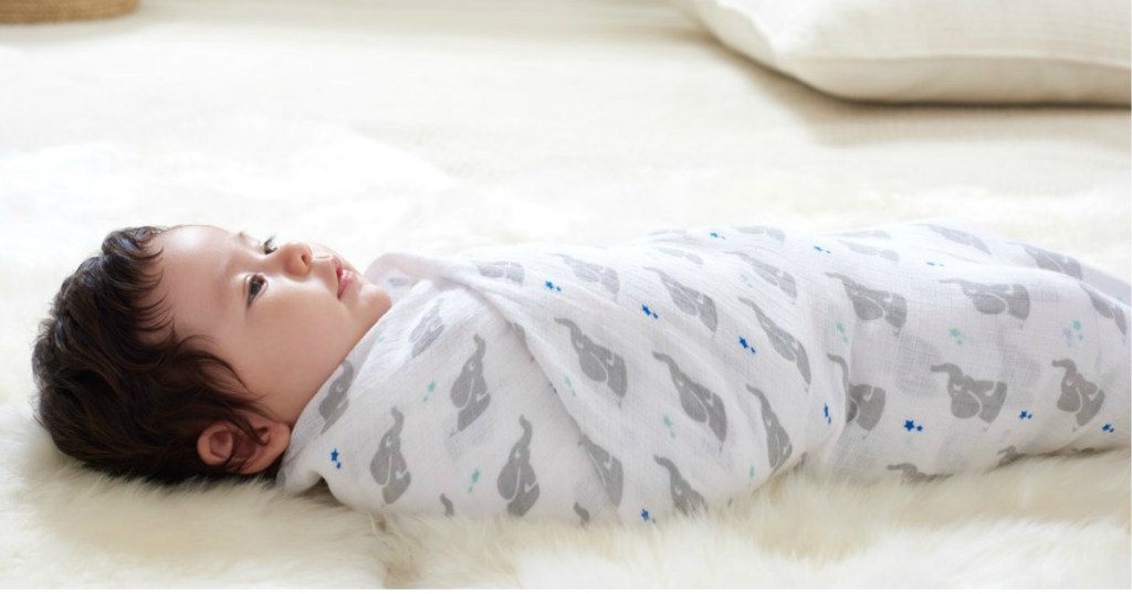 baby wrapped up in aden by aden + anais Muslin Swaddle Baby Blankets