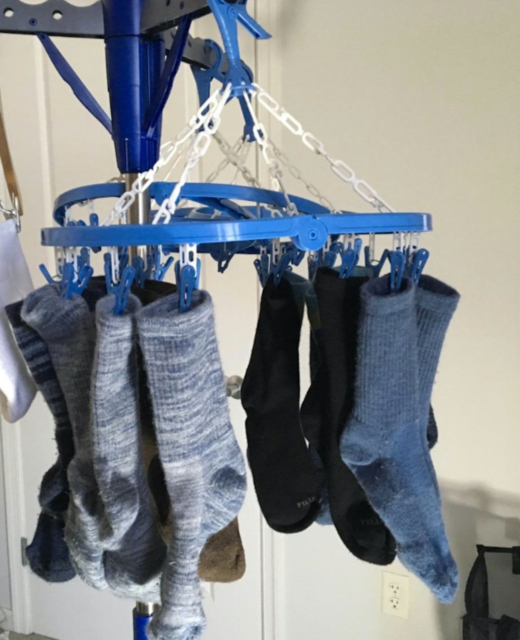 laundry room organization hanging clips dryer with various pairs of socks