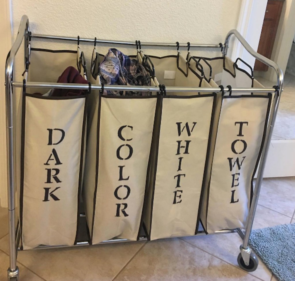 cream colored laundry cart with labeled baskets 