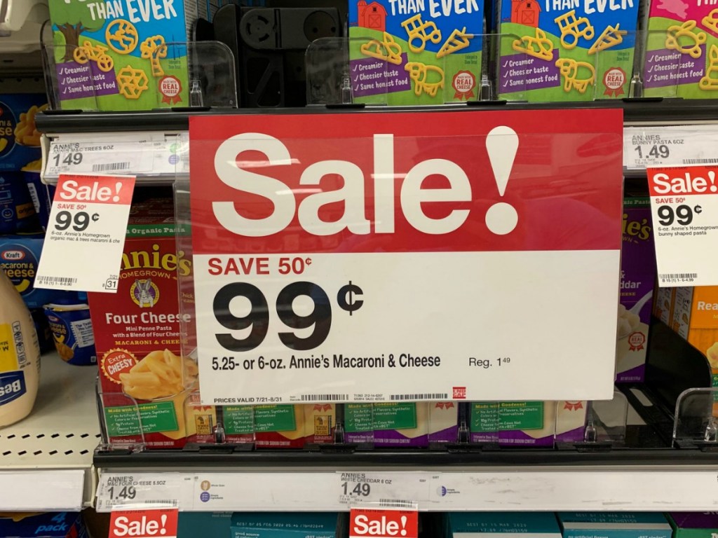 sign on store display with macaroni and cheese boxes