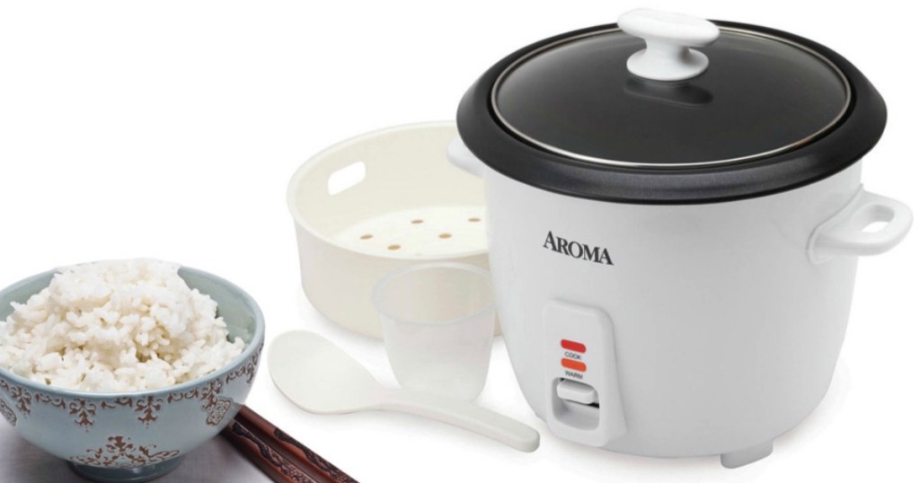aroma rice cooker with bowl of rice and accessories