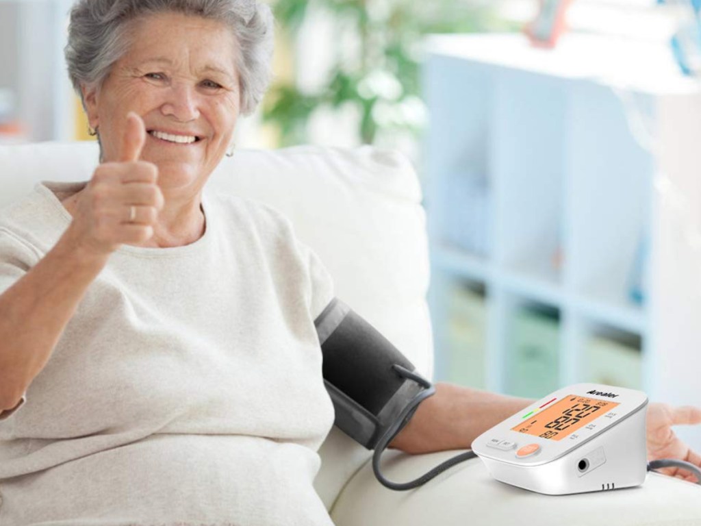 woman with blood pressure monitor