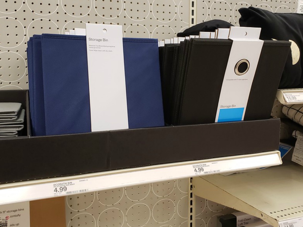 blue and black storage bins on store shelf