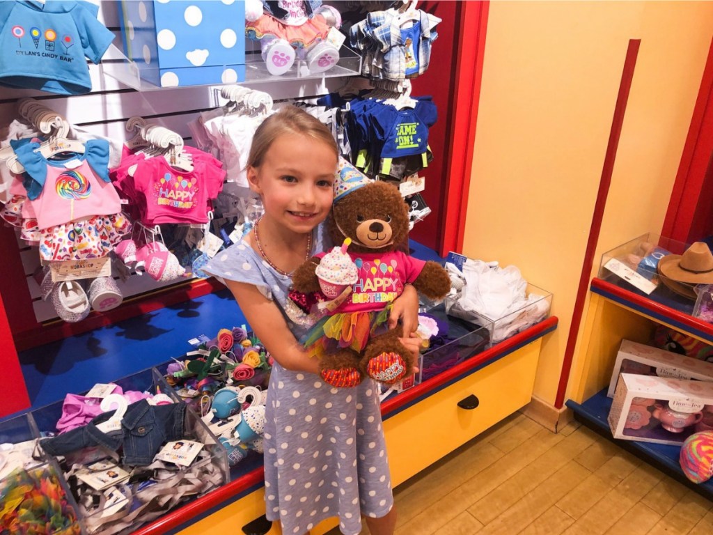 girl with plush bear at Build-a-bear store
