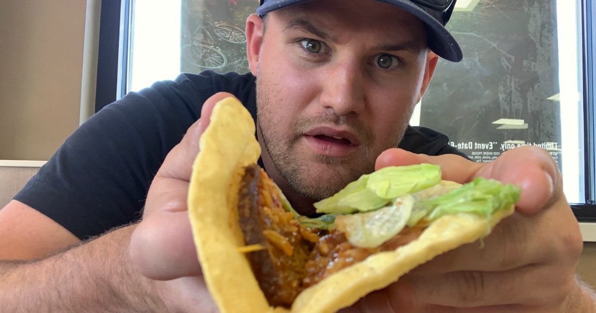 stetson holding open burger kind taco