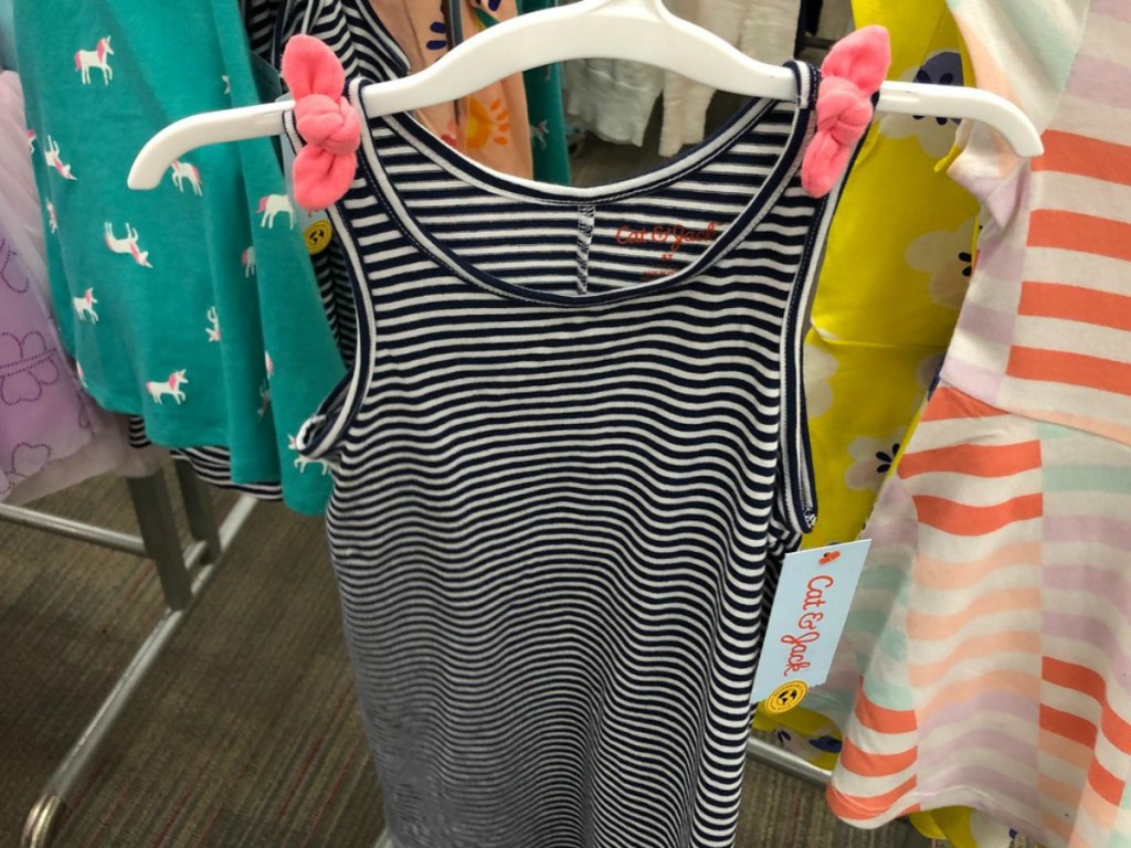 dress with stripes and bows for shoulder ties on hanger