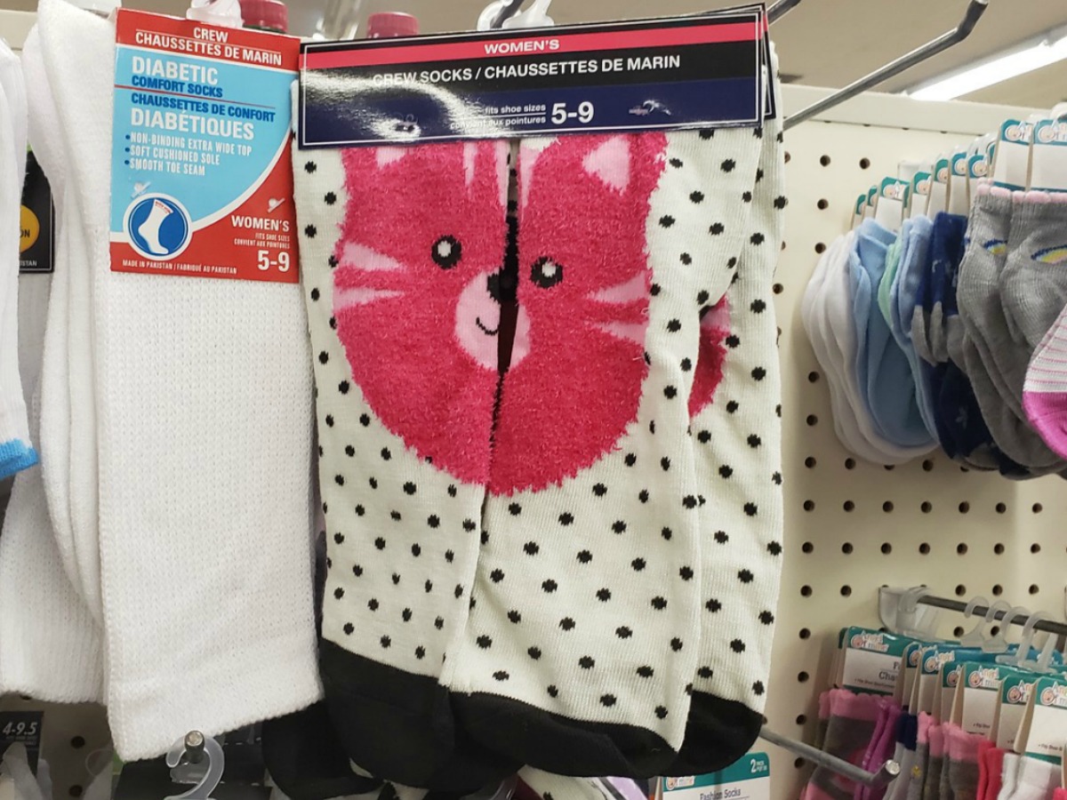 women's socks hanging in store with cat face
