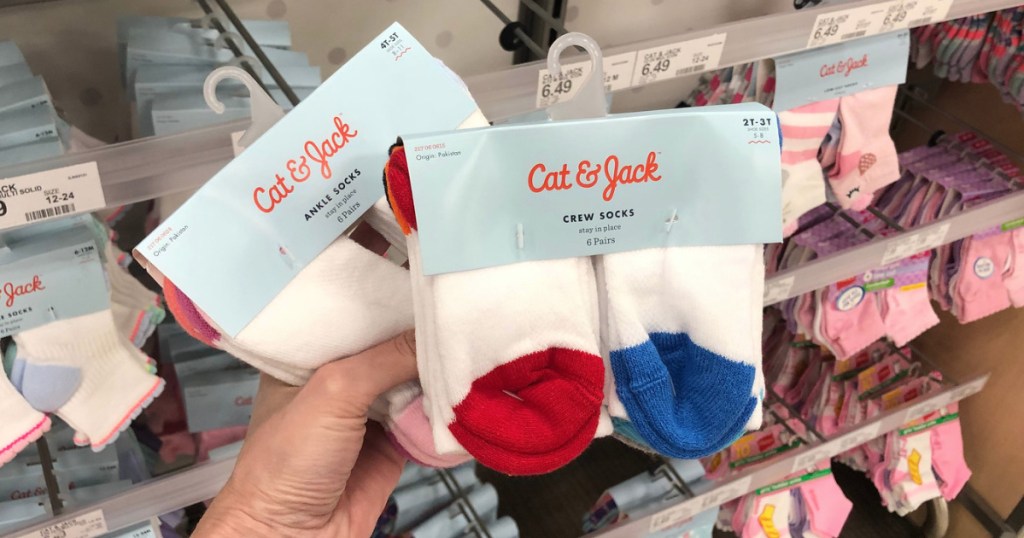hand holding cat & jack infant socks at Target