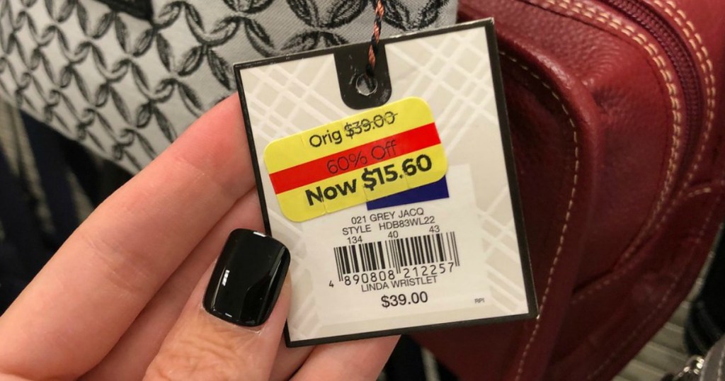 hand holding a clearance price tag in store