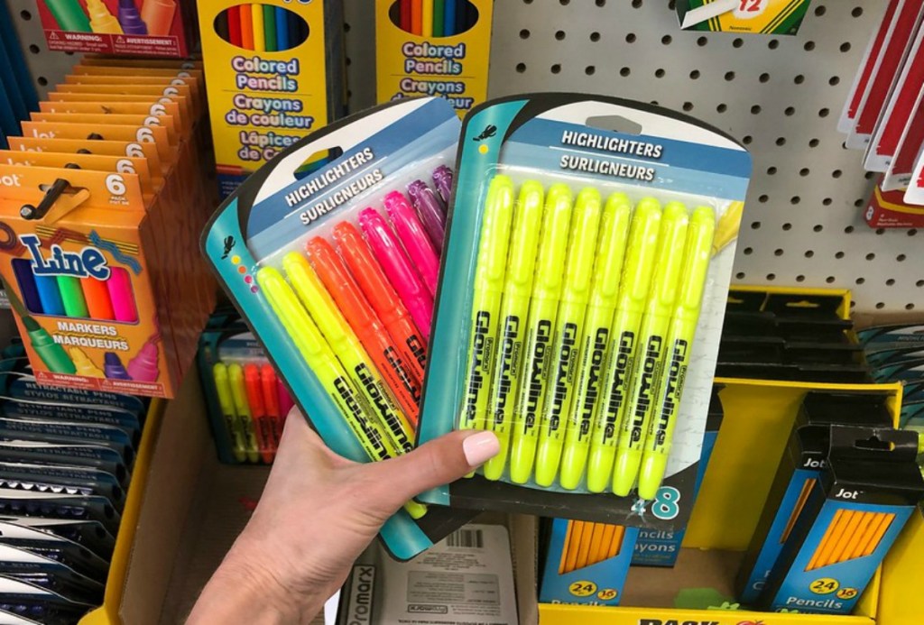 two packs of highlighters being held in hand at store