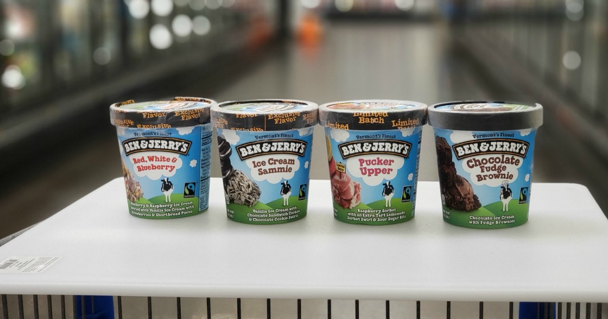 four pints of Ben & Jerry's ice cream sitting on white cutting board placed on top of cart