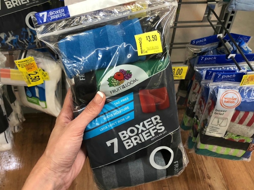 hand holding package of boys underwear in store