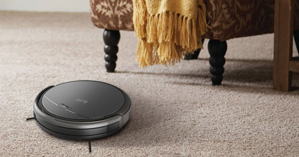 ILIFE A4S Robot Vacuum Cleaner on carpet with chair and yellow blanket