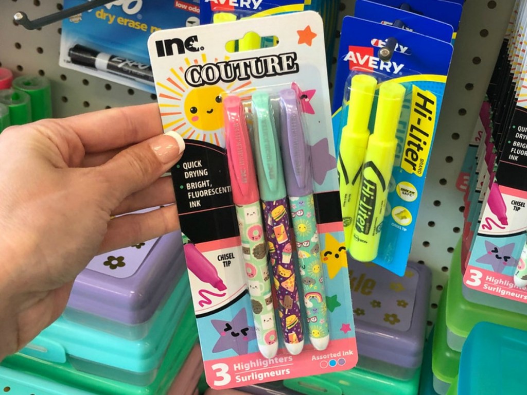 hand holding 3 pack of decorated highlighters in store