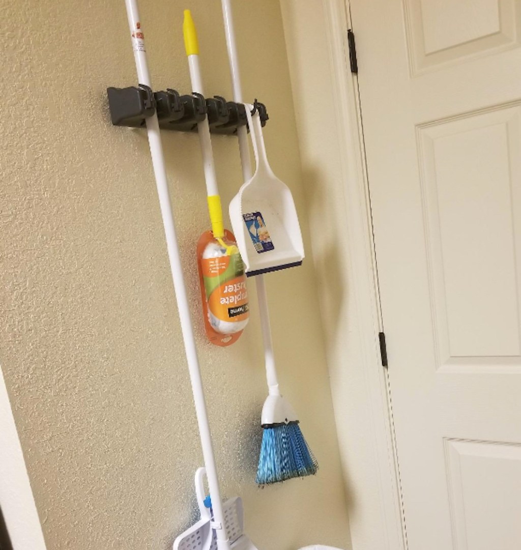 tool laundry room organization wall mounted with brooms hanging from hooks
