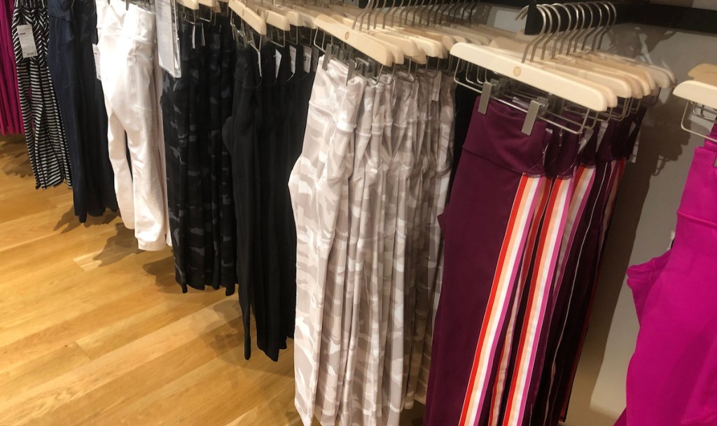 various colors of leggings lined up at store