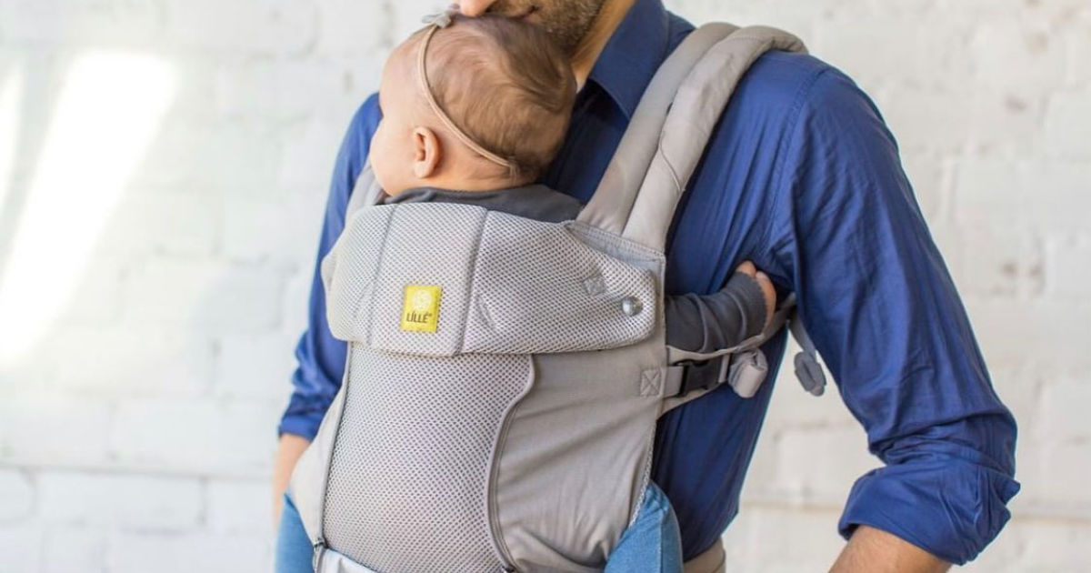 man wearing lillebaby carrier with baby in it