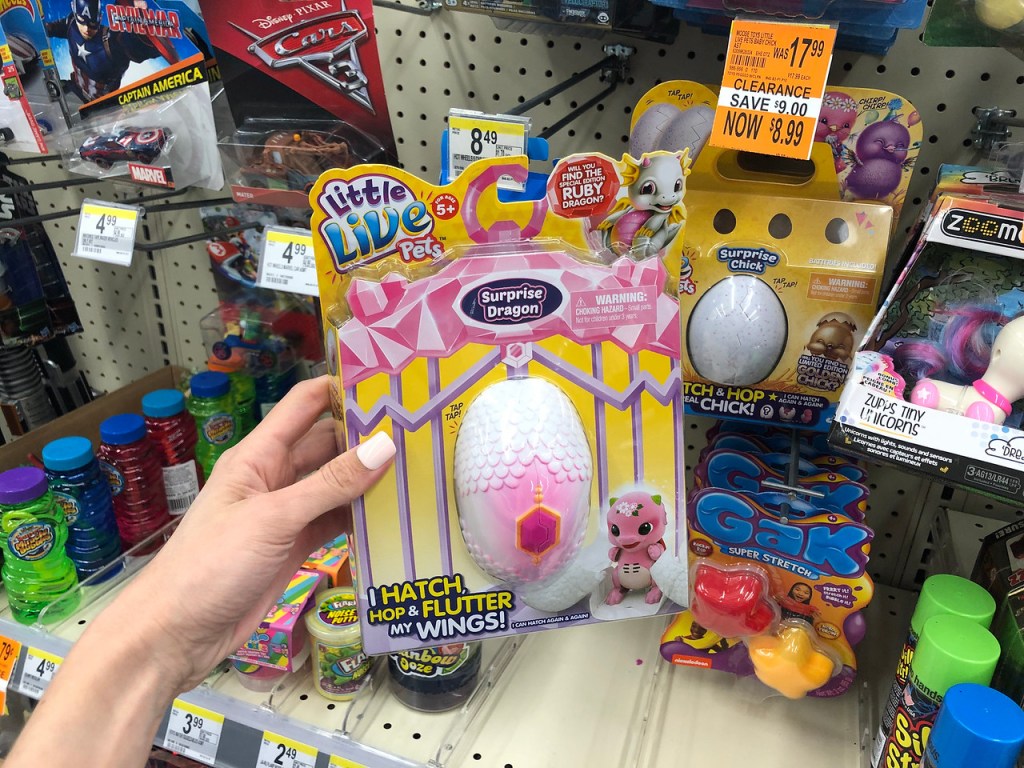 hand holding toy with egg on it in store