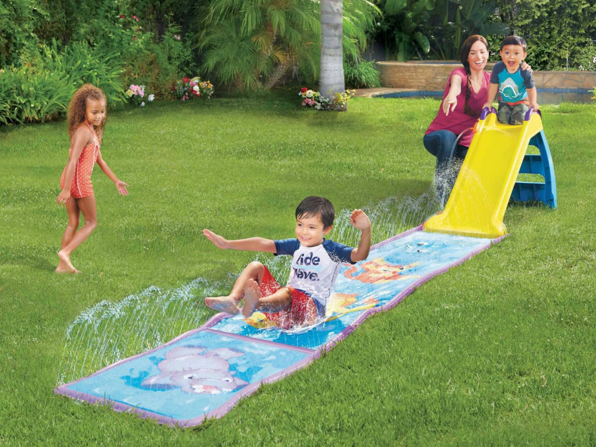 kids playing on little tikes my first water slide