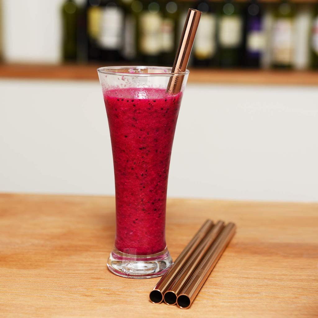 metal straw in strawberry smoothie 
