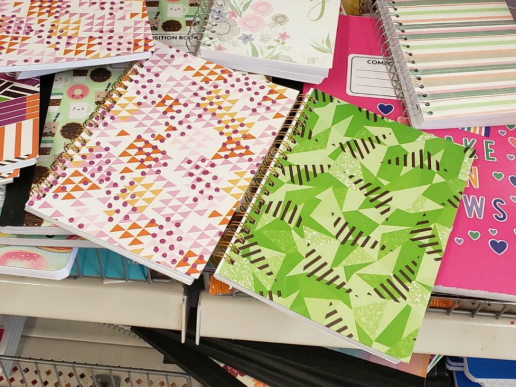 spiral notebooks in colors and designs on store shelf
