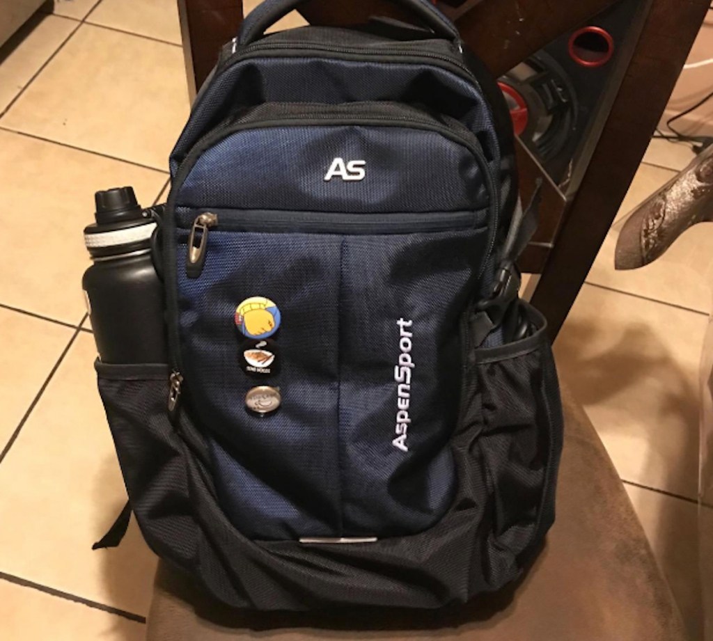 navy book bag sitting on chair