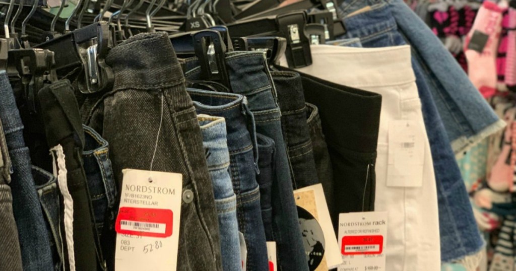 close up of rack of jeans with Nordstrom tags
