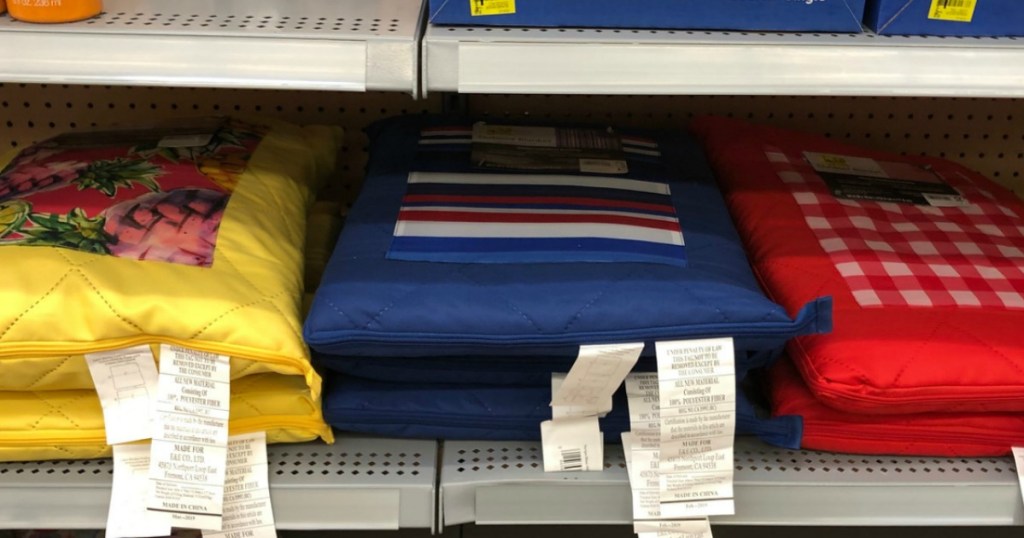 store shelf with colorful blankets on it