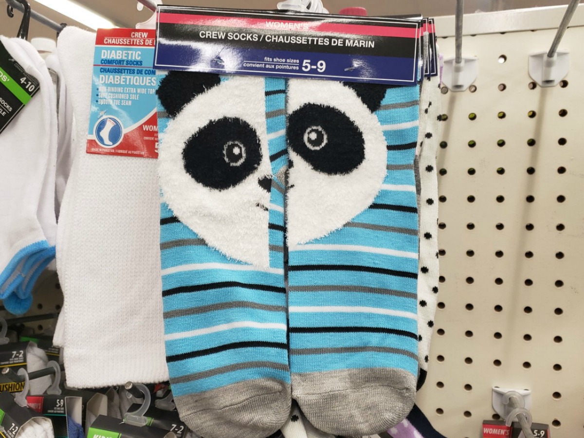socks hanging in store on display with panda face
