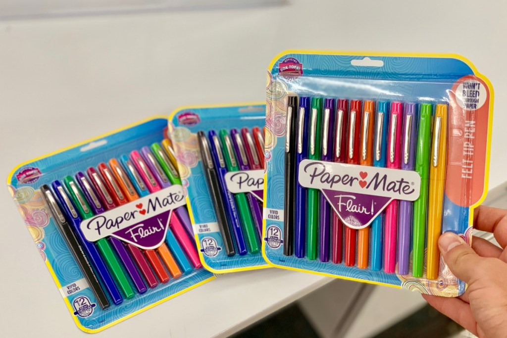 hand holding papermate flair pens