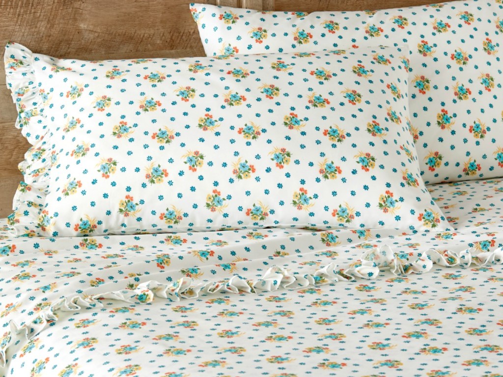 sheets on a bed with ruffles and pillows