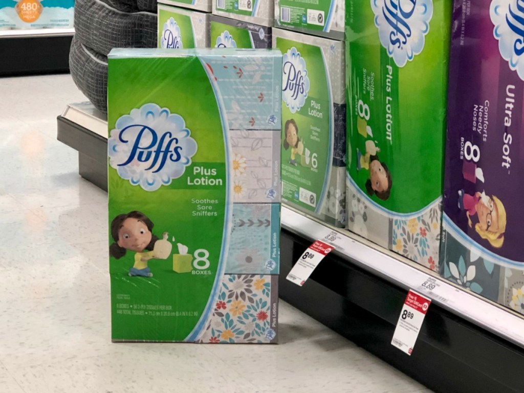 packs of puffs tissue by store display