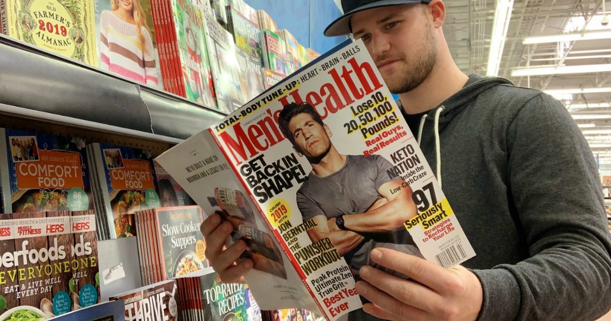 man reading a health magazine in a store