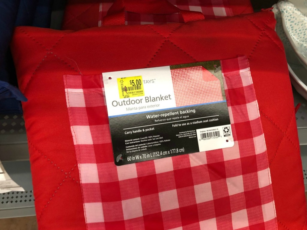 red blanket with clearance tag on it in store