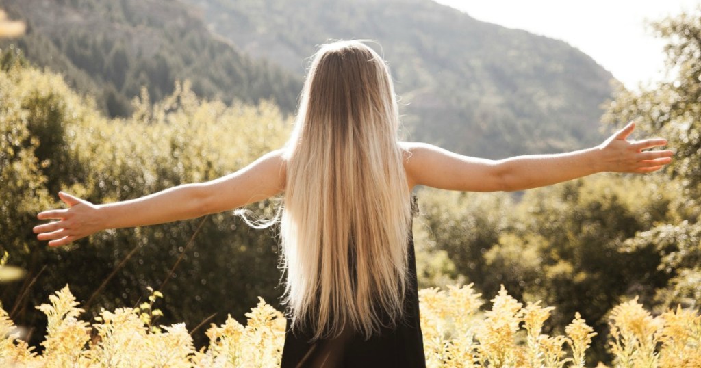 woman with blonde straight hair outdoors