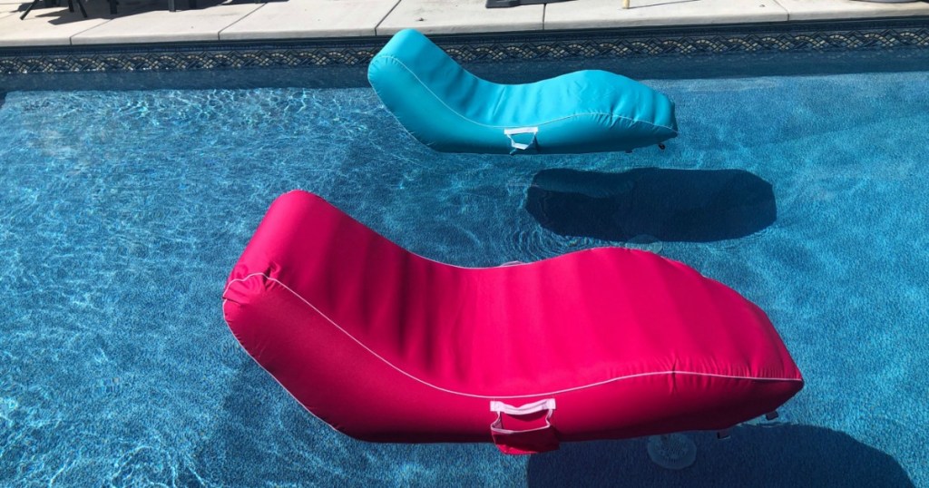 pink and blue floating chairs on pool