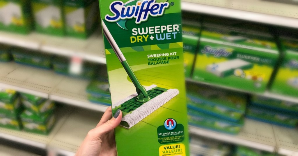 hand holding swiffer dry mop in store