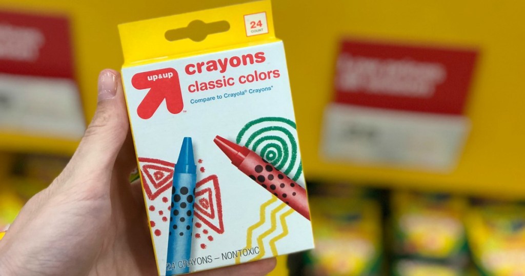 hand holding up & up crayons at target
