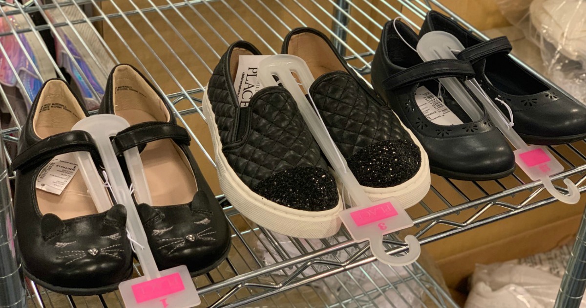 cat shoes, quilted shoes and flower cut out shoes on store rack