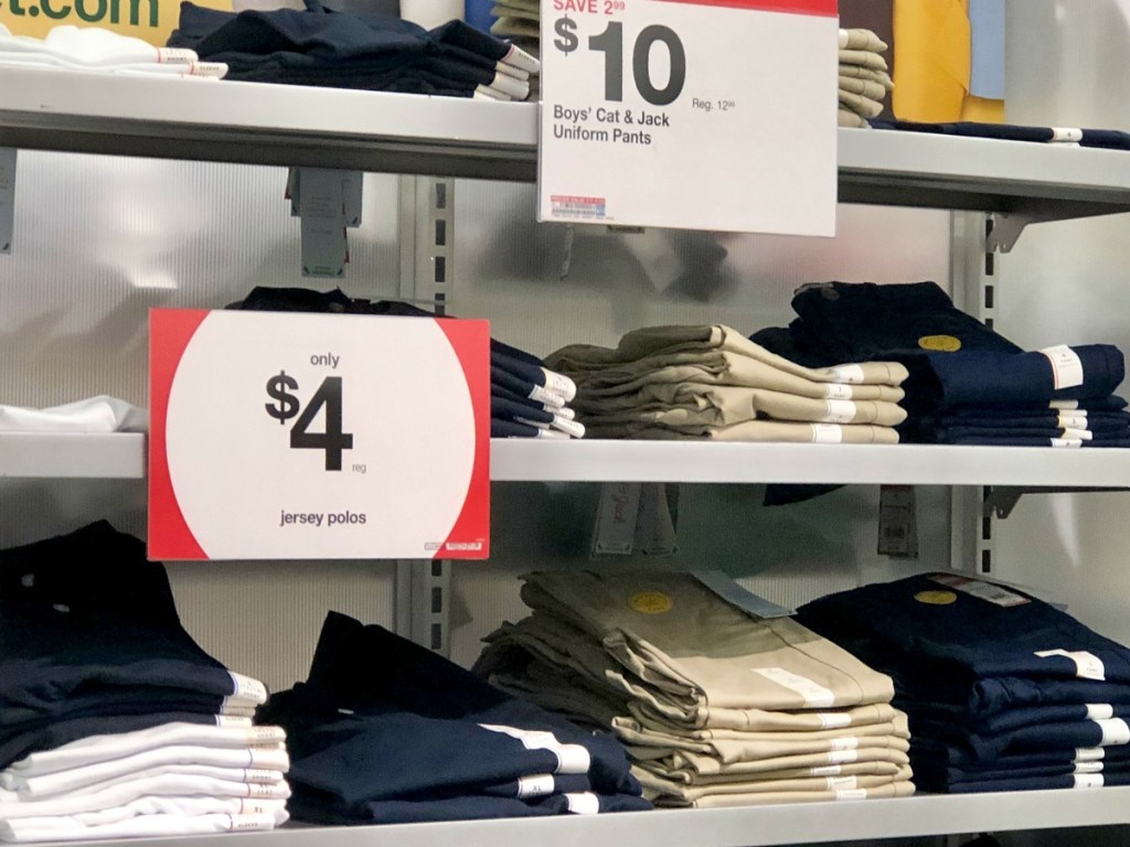 Uniform tops and bottoms on display racks at Target