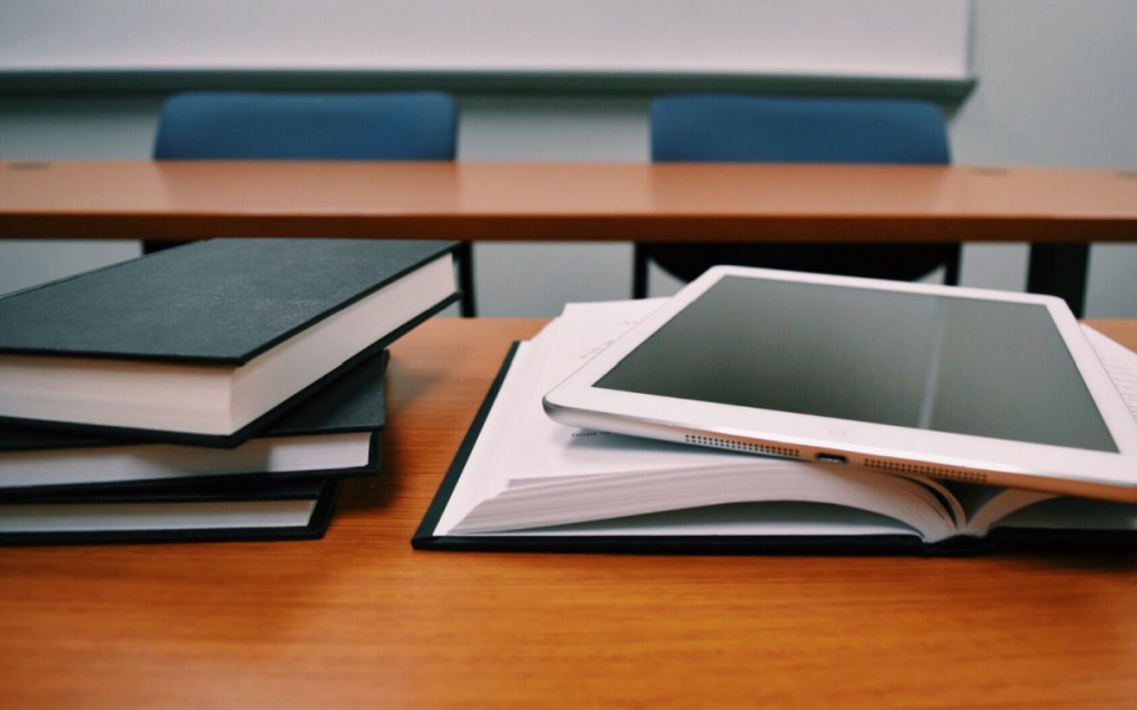 university tablet and books